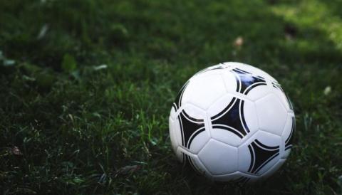 soccer ball on green glass